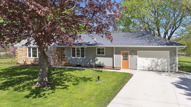 1431 E Oliver St, Owosso, MI 48867 - ranch-style house featuring a garage, concrete driveway, and a front yard