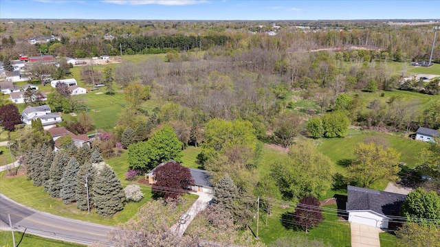1431 E Oliver St, Owosso, MI 48867 - drone / aerial view of a heavily wooded area