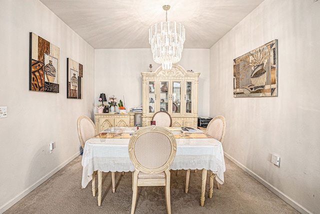 5695 Storrow Ct, Warren, MI 48092 - dining space featuring a chandelier, carpet flooring, and baseboards
