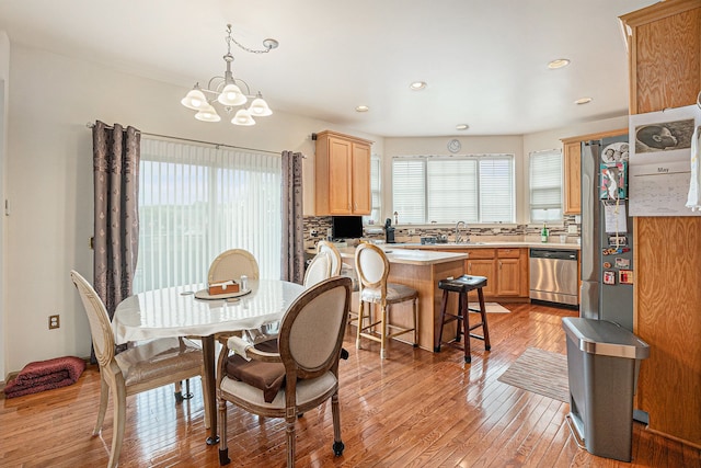 5695 Storrow Ct, Warren, MI 48092 - dining area with a chandelier, light wood-type flooring, and recessed lighting