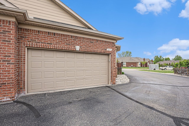 5695 Storrow Ct, Warren, MI 48092 - garage featuring driveway and a residential view