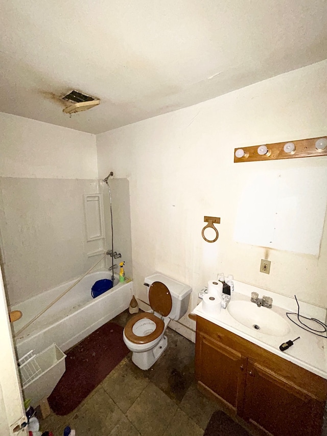 bathroom featuring vanity, toilet, and bathing tub / shower combination