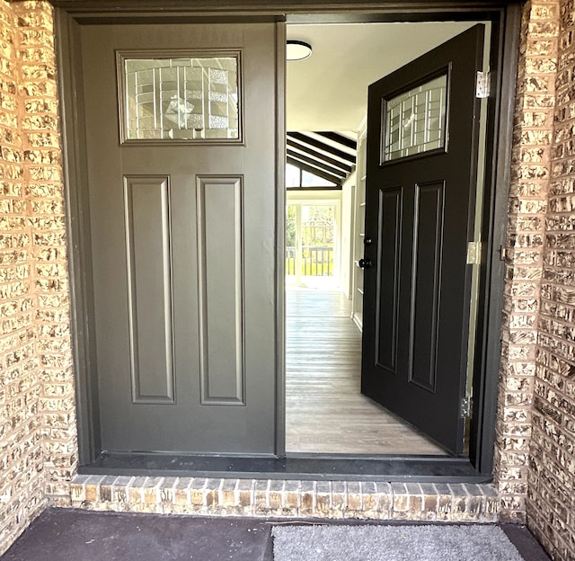 59663 Pettengill Dr, New Hudson, MI 48165 - doorway to property featuring brick siding