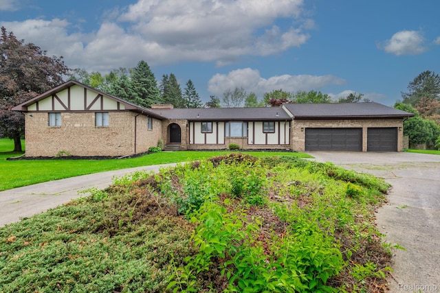 59663 Pettengill Dr, New Hudson, MI 48165 - view of front of property featuring driveway, an attached garage, brick siding, a front yard, and a chimney