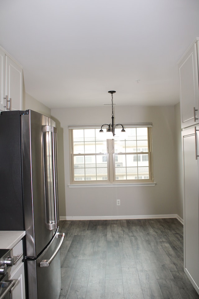 414 Old Pine Way Unit 136, Walled Lake, MI 48390 - kitchen featuring freestanding refrigerator, dark wood-style flooring, plenty of natural light, and white cabinetry