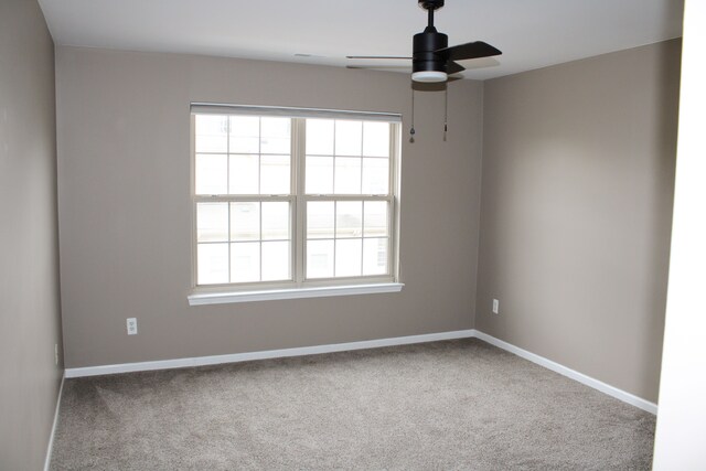 414 Old Pine Way Unit 136, Walled Lake, MI 48390 - carpeted empty room featuring ceiling fan, plenty of natural light, and baseboards