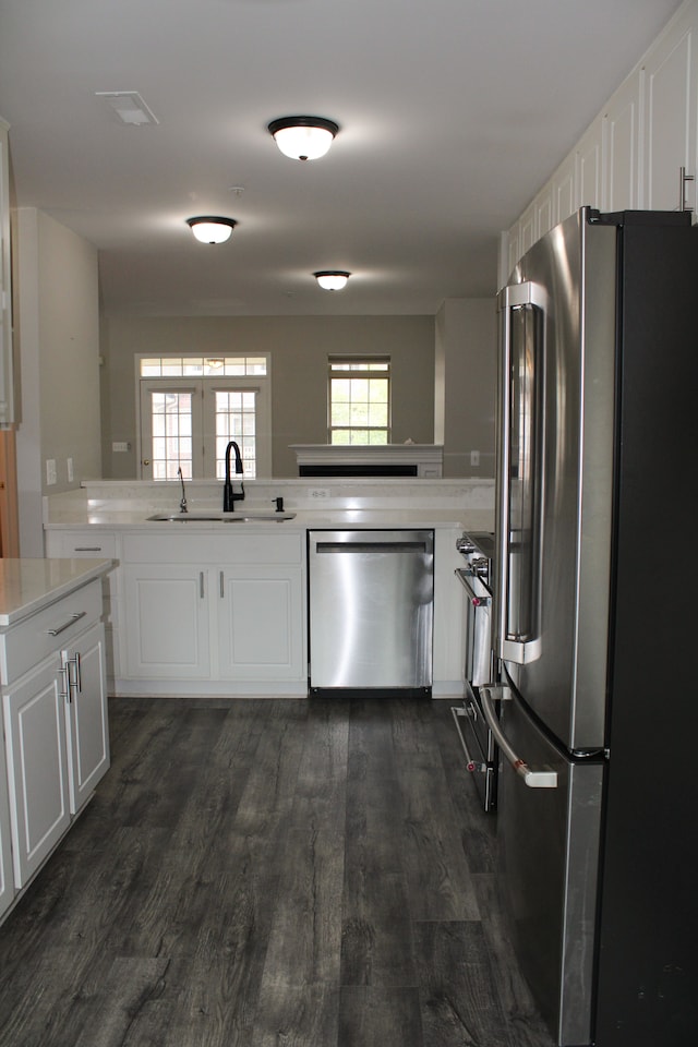 414 Old Pine Way Unit 136, Walled Lake, MI 48390 - kitchen featuring stainless steel appliances, a sink, light countertops, dark wood-style floors, and white cabinets
