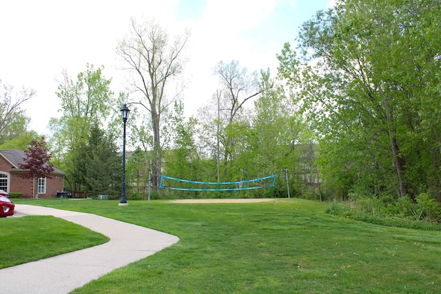 414 Old Pine Way Unit 136, Walled Lake, MI 48390 - view of grassy yard with volleyball court