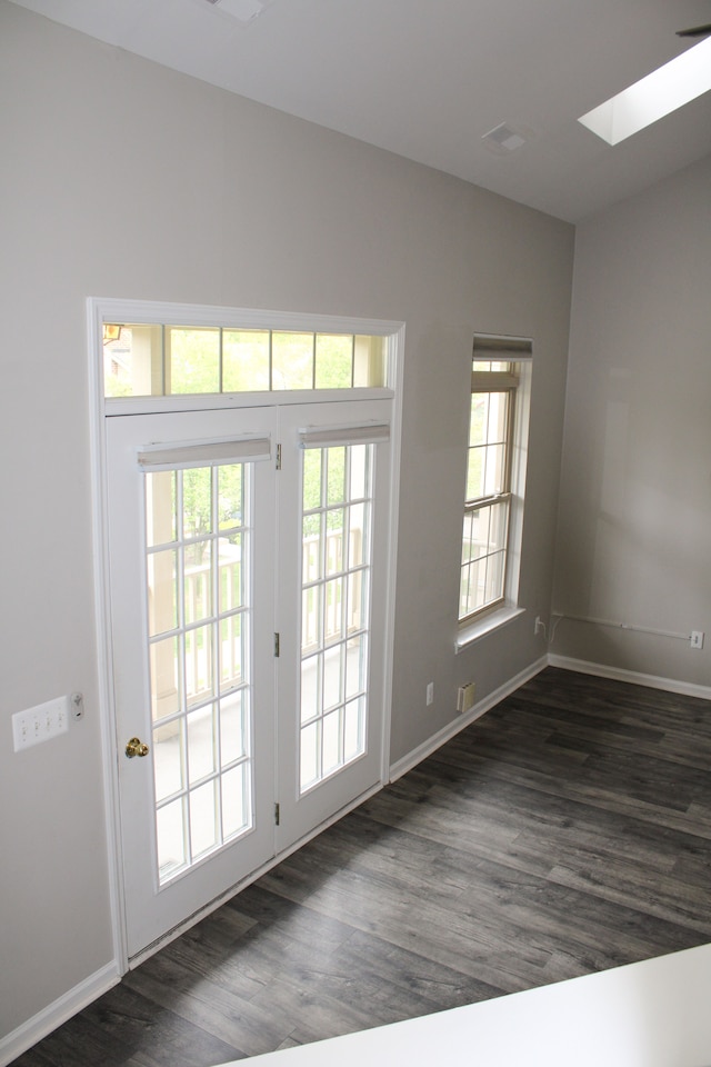 414 Old Pine Way Unit 136, Walled Lake, MI 48390 - doorway to outside with a skylight, dark wood finished floors, and baseboards