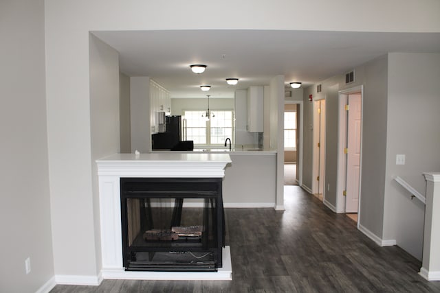 414 Old Pine Way Unit 136, Walled Lake, MI 48390 - living room featuring dark wood-style floors and baseboards