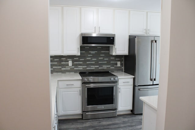 414 Old Pine Way Unit 136, Walled Lake, MI 48390 - kitchen with appliances with stainless steel finishes, white cabinetry, light countertops, and dark wood-style flooring