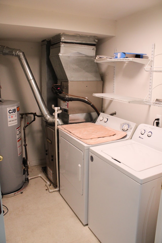 414 Old Pine Way Unit 136, Walled Lake, MI 48390 - laundry area featuring washing machine and clothes dryer and water heater