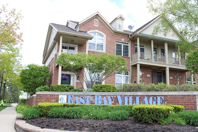 414 Old Pine Way Unit 136, Walled Lake, MI 48390 - view of front facade with brick siding