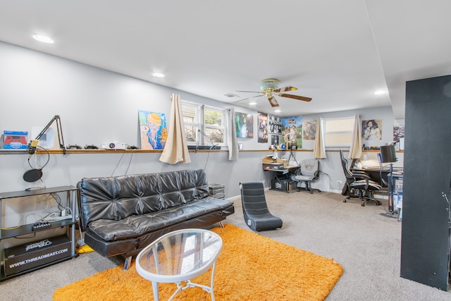 living area featuring ceiling fan, a desk, recessed lighting, carpet floors, and plenty of natural light