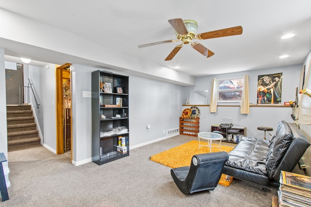 carpeted living room with stairs, a ceiling fan, baseboards, and recessed lighting