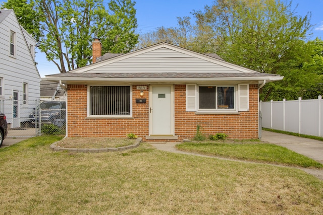 bungalow-style house featuring brick siding, a chimney, and roof with shingles