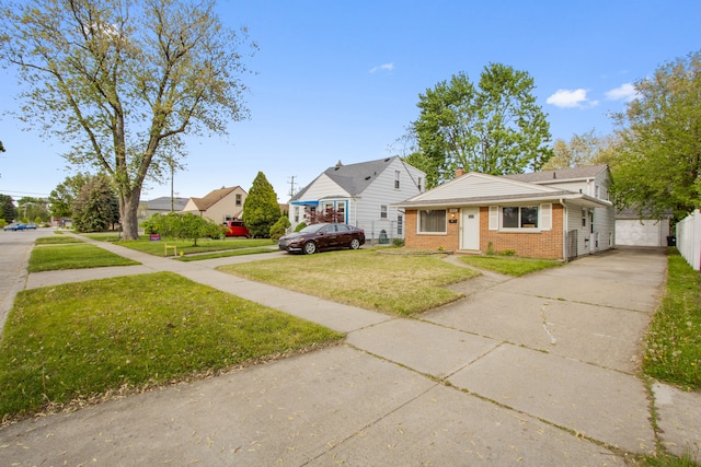 bungalow with brick siding, a front yard, driveway, and a garage