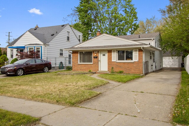 bungalow with a chimney, driveway, an outdoor structure, brick siding, and roof with shingles
