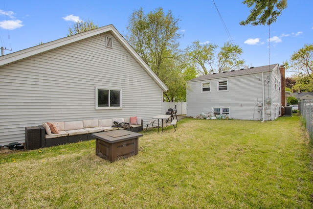 rear view of property with an outdoor living space
