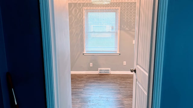 bathroom featuring wood finished floors and baseboards