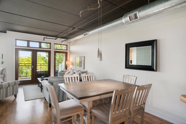 12 Washington Ave Unit 8, Grand Haven, MI 49417 - dining room with wood finished floors, baseboards, and french doors