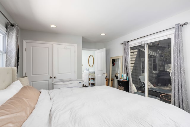 bedroom featuring access to outside, a closet, and recessed lighting