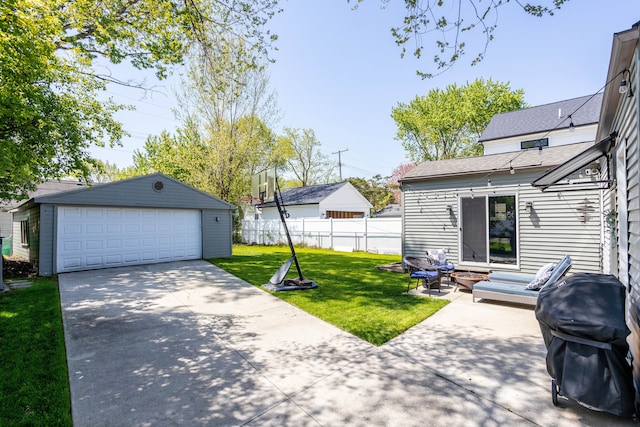 view of yard with an outdoor structure and a garage