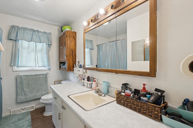 2726 Horton Ct, Niles, MI 49120 - full bathroom with toilet, vanity, a shower with curtain, and baseboards