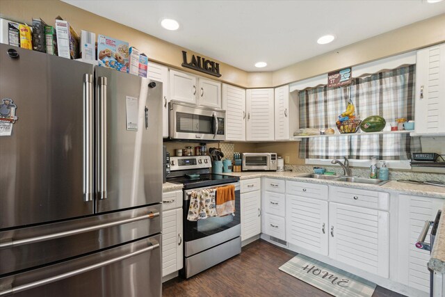 2726 Horton Ct, Niles, MI 49120 - kitchen with appliances with stainless steel finishes, a sink, white cabinets, dark wood finished floors, and recessed lighting