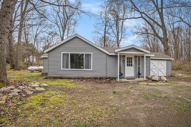 6280 Gleason Rd, Saugatuck, MI 49453 - ranch-style house with a garage