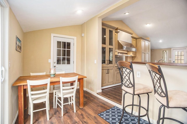 6280 Gleason Rd, Saugatuck, MI 49453 - dining space with lofted ceiling, dark wood-style flooring, and baseboards