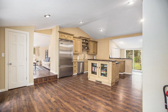 6280 Gleason Rd, Saugatuck, MI 49453 - kitchen with stainless steel appliances, vaulted ceiling, dark wood finished floors, open shelves, and cream cabinets