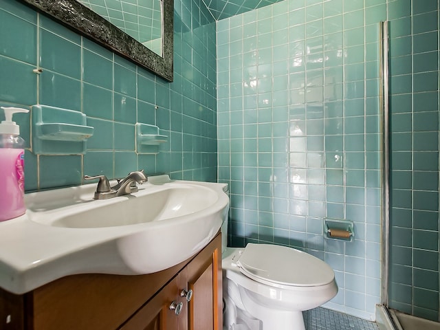 8320 Nightingale St, Dearborn Heights, MI 48127 - bathroom featuring tile walls, vanity, toilet, a stall shower, and tile patterned floors