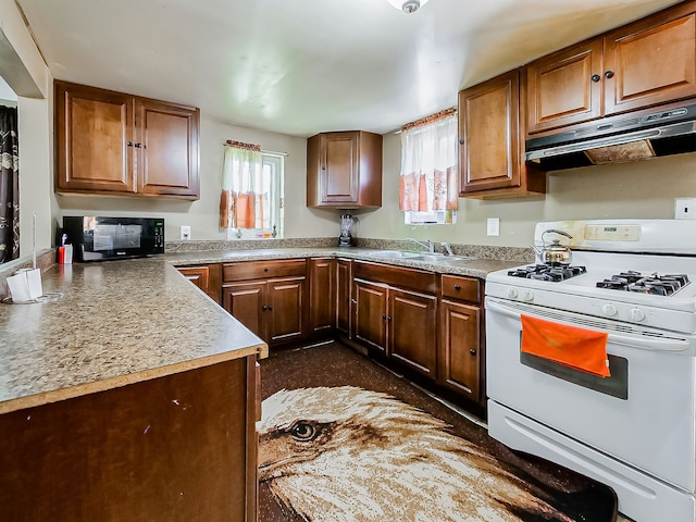 8320 Nightingale St, Dearborn Heights, MI 48127 - kitchen featuring white range with gas cooktop, black microwave, under cabinet range hood, a sink, and brown cabinetry