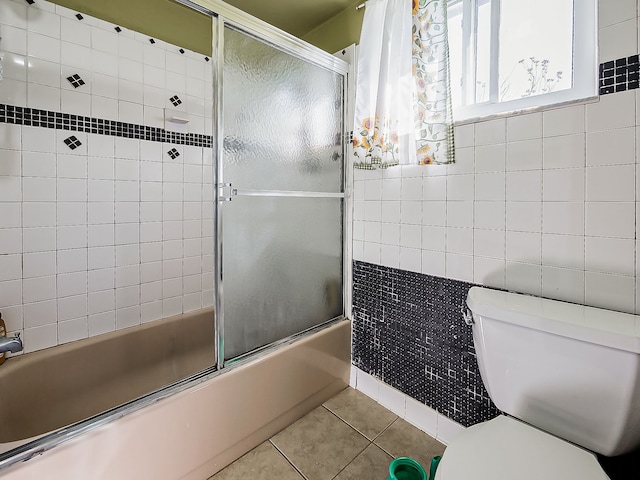 8320 Nightingale St, Dearborn Heights, MI 48127 - full bath with tile patterned flooring, toilet, combined bath / shower with glass door, and tile walls