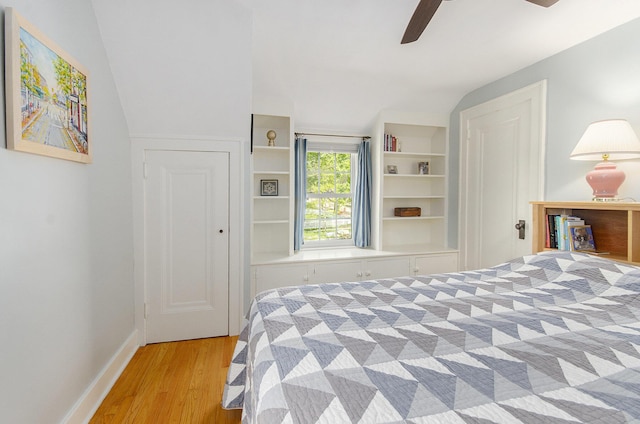 bedroom with wood finished floors, baseboards, and ceiling fan