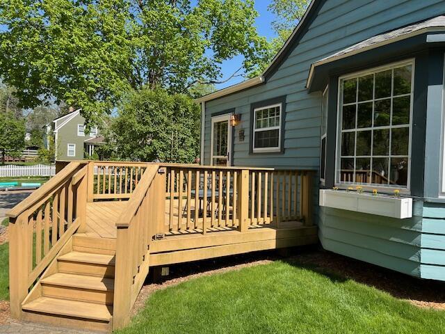 wooden terrace featuring stairs