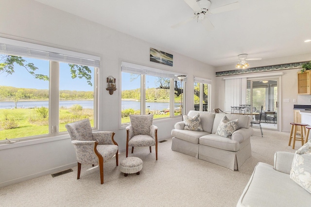 9458 Edwin Markham Rd, Brooklyn, MI 49230 - living room with ceiling fan, a water view, and healthy amount of natural light