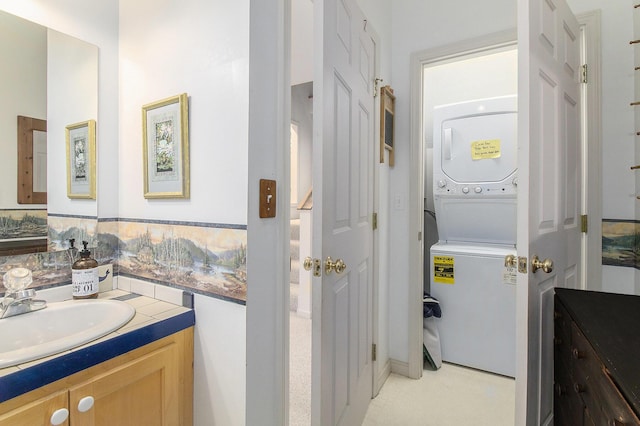 9458 Edwin Markham Rd, Brooklyn, MI 49230 - bathroom featuring stacked washing machine and dryer and vanity