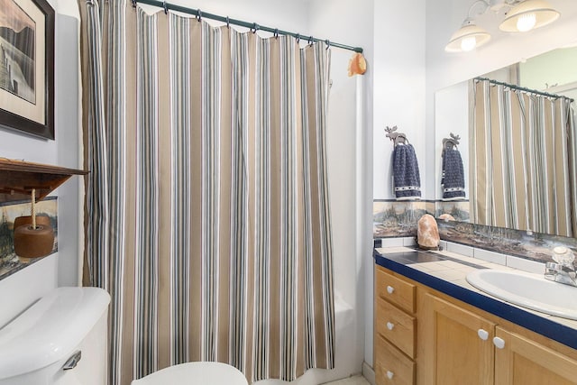 9458 Edwin Markham Rd, Brooklyn, MI 49230 - bathroom featuring toilet, vanity, and curtained shower