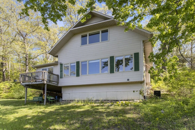 9458 Edwin Markham Rd, Brooklyn, MI 49230 - rear view of house with a deck and a yard