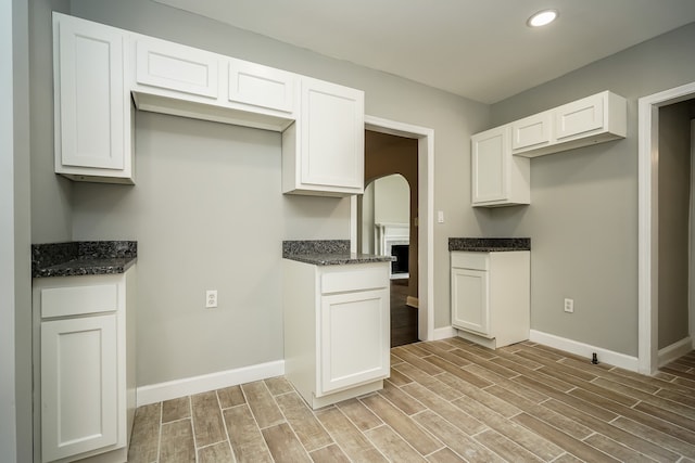 17344 Wisconsin St, Detroit, MI 48221 - kitchen featuring baseboards, light wood-style floors, white cabinets, and recessed lighting