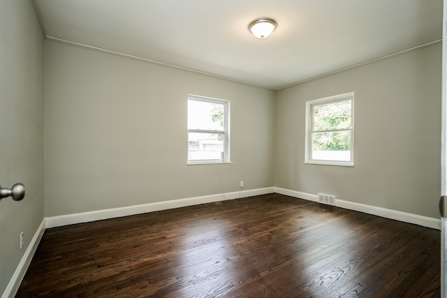 17344 Wisconsin St, Detroit, MI 48221 - spare room featuring dark wood-style flooring, baseboards, and ornamental molding