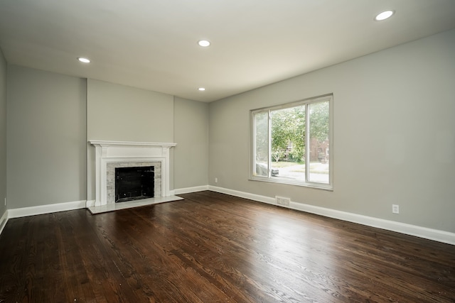 17344 Wisconsin St, Detroit, MI 48221 - unfurnished living room featuring wood finished floors, a fireplace, recessed lighting, and baseboards