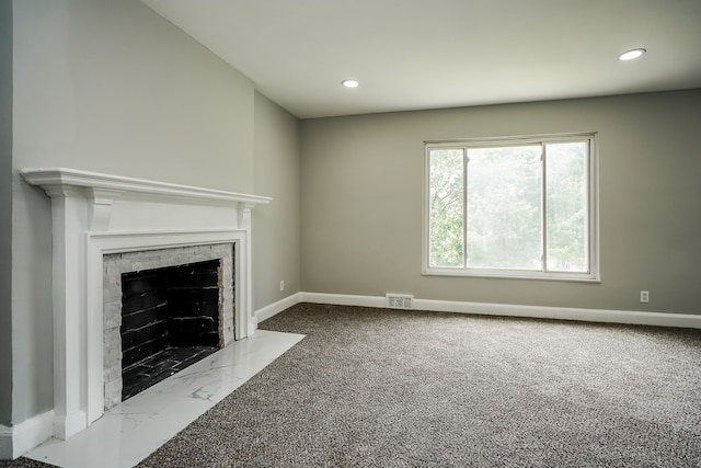 17344 Wisconsin St, Detroit, MI 48221 - unfurnished living room featuring baseboards, a fireplace with flush hearth, recessed lighting, and carpet