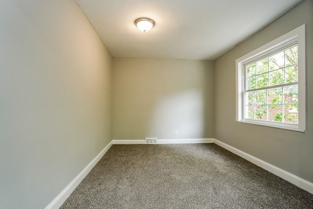 17344 Wisconsin St, Detroit, MI 48221 - spare room featuring dark colored carpet and baseboards