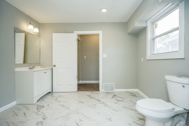 17344 Wisconsin St, Detroit, MI 48221 - half bathroom featuring baseboards, toilet, vanity, recessed lighting, and marble look tiles
