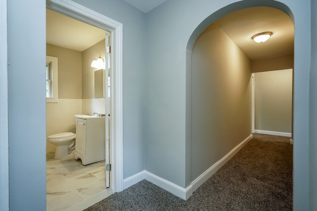 17344 Wisconsin St, Detroit, MI 48221 - corridor featuring arched walkways and light marble finish floors