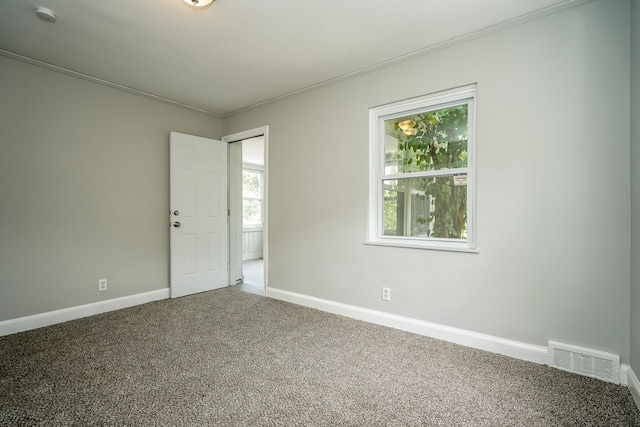 17344 Wisconsin St, Detroit, MI 48221 - empty room featuring carpet floors, baseboards, plenty of natural light, crown molding, and a smoke detector