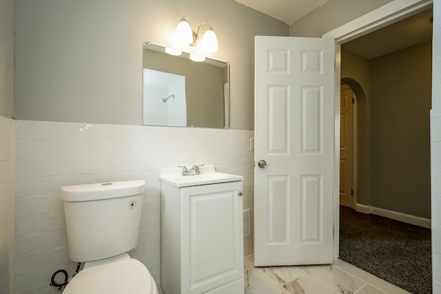 17344 Wisconsin St, Detroit, MI 48221 - bathroom featuring toilet, vanity, and tile walls